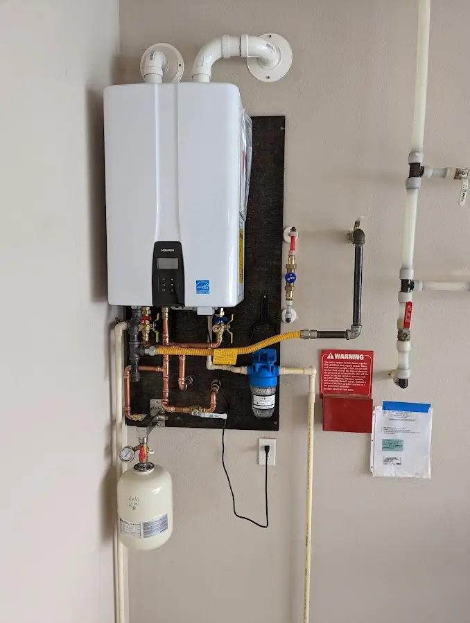 Professional plumber installing copper piping in a South San Gabriel home